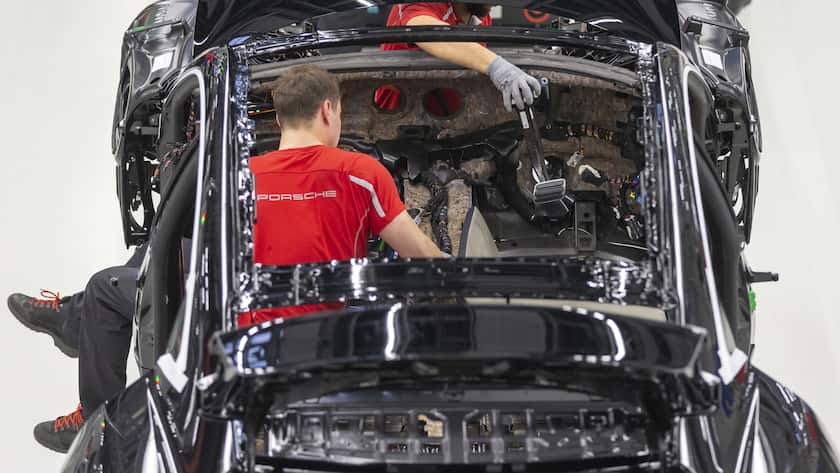 epa08271961 A view of the production of Taycan electric sports cars at an assembly line at the German car manufacturer Porsche in Stuttgart, Germany, 05 March 2020. Porsche AG is a listed German manufacturer of luxury sports cars, SUVs and sedans based in Stuttgart. Porsche AG will present the results of the 2020 financial year at the annual press conference on 24 March 2020. EPA/RONALD WITTEK