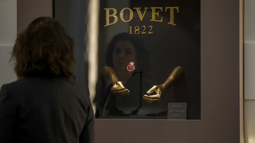 A visitor looks a watch at the Bovet booth, during the first day of the 29th edition of the Salon International de la Haute Horlogerie, SIHH, in Geneva, Switzerland, Monday, January 14, 2019. (KEYSTONE/Salvatore Di Nolfi)
