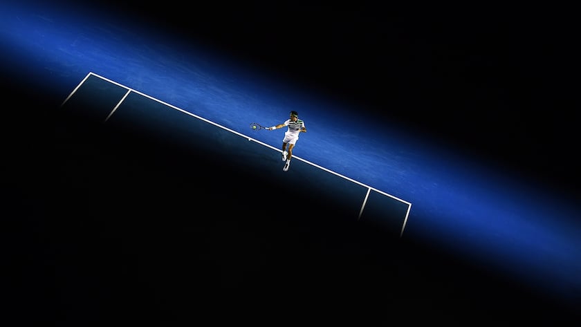 epa05117871 Roger Federer of Switzerland plays a return against Grigor Dimitrov of Bulgaria during their third round match for the Australian Open tennis tournament in Melbourne, Australia, 22 January 2016. EPA/LUKAS COCH AUSTRALIA AND NEW ZEALAND OUT