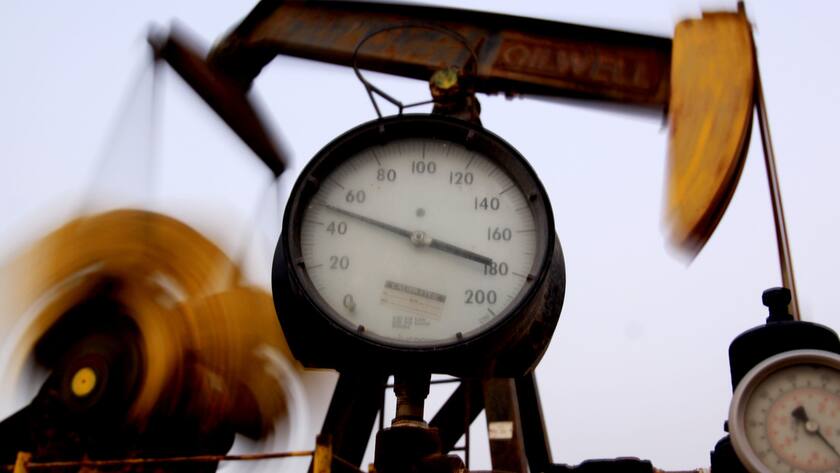 An oil pump works Thursday, Aug. 5, 2010, in the Persian Gulf desert oil fields of Sakhir, Bahrain. Oil prices hovered above $82 a barrel Thursday in Asia, pausing from a rally that lifted the commodity to a three-month high this week amid positive U.S. corporate earnings and economic figures. (AP Photo/Hasan Jamali)