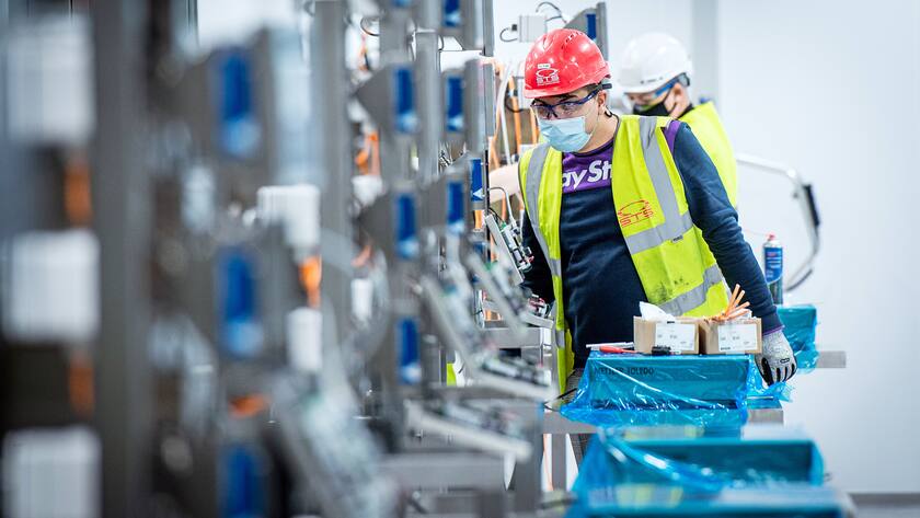 A staff member sets up an antibody production line at the Ibex building of Lonza, where part of the Moderna mRNA coronavirus disease (COVID-19) vaccine will be produced, in Visp, Switzerland, October 6, 2020. (KEYSTONE/Olivier Maire)