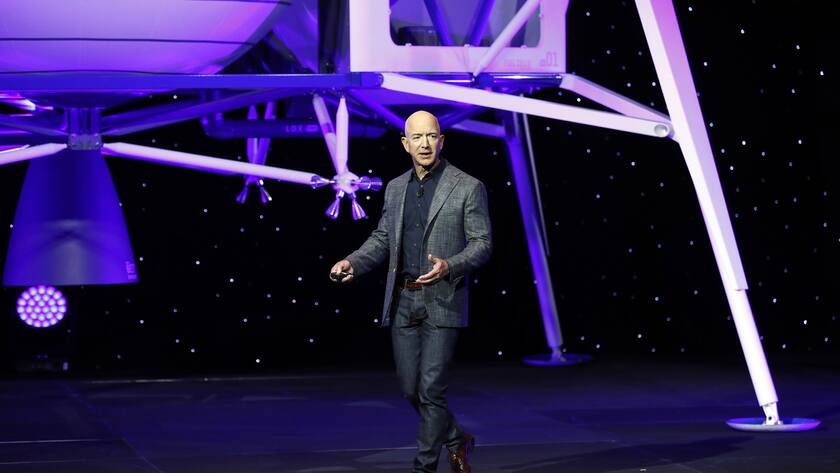 Jeff Bezos speaks in front of a model of Blue Origin's Blue Moon lunar lander, Thursday, May 9, 2019, in Washington. (AP Photo/Patrick Semansky)