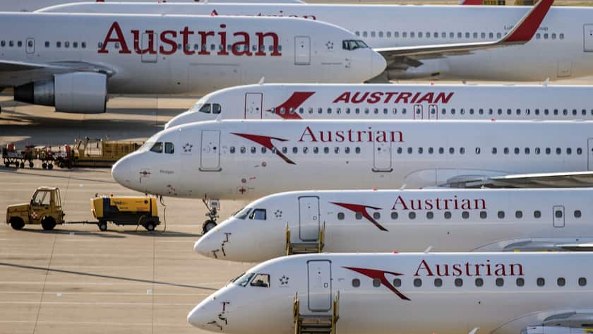 epa08406730 General view of Austrian Airlines (AUA) planes grounded at the Vienna International Airport (VIC) in Schwechat, Austria, 07 May 2020. According to media reports, AUA, part of the Lufthansa Group and headquartered in Vienna, Austria, is planning to cut 1,100 of the 7,000 jobs by 2023 and that wages are to fall by 13 per cent. The company temporarily suspended all regular flight operations due to the SARS-CoV-2 coronavirus, which causes the COVID-19 disease. EPA/CHRISTIAN BRUNA