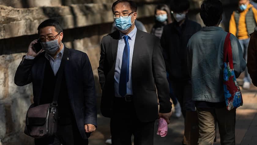 epa08223553 Pedestrians wear face masks in Hong Kong, China, 17 February 2020. As of 17 February, the number of those infected by the coronavirus that causes the disease known as Covid-19, also known as coronavirus, grew to 59 in Hong Kong. More than 70,000 people have been infected in mainland China with the death toll at 1,770. EPA/JEROME FAVRE