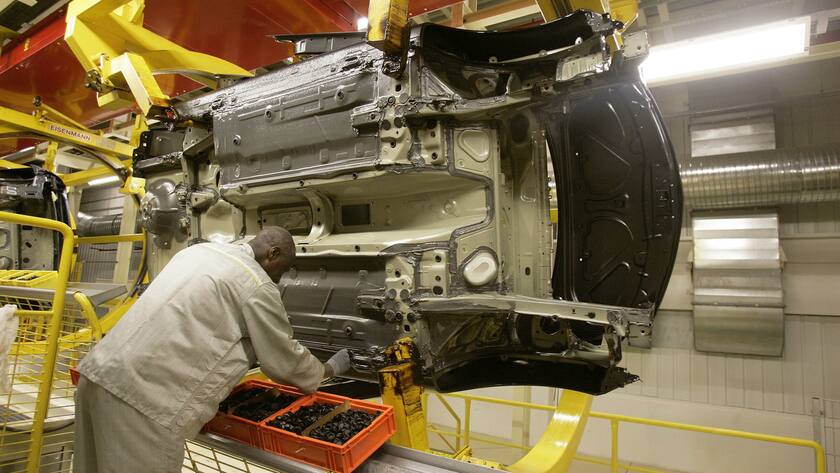 This May 17, 2006 photo shows an employee at the Clio car assembly line of the Renault plant in Flins, west of Paris. France is considering "several billion euros" in extra help for its auto makers. The government is hosting a meeting on Tuesday Jan.20, 2009 with French car makers, suppliers and labor unions to discuss how to cushion the fallout from the economic crisis and credit restrictions. (AP Photo/Michel Euler)