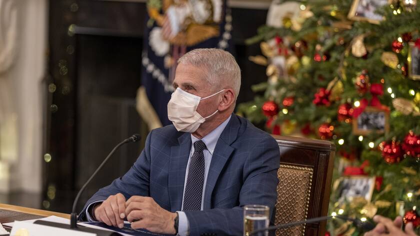 epa09632910 Dr. Anthony Fauci, Director of the National Institute of Allergy and Infectious Diseases and Chief Medical Advisor to the President listens to President Joe Biden as he delivers remarks, in the state dinning room, at the White House in Washington, D.C., USA, 09 December 2021. US President and the Vice President held a meeting with members of the White House COVID-19 Response Team on the latest developments related to the Omicron variant. EPA/TASOS KATOPODIS / POOL