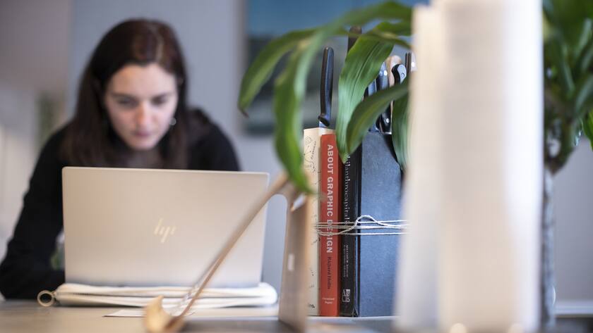 A woman works at the coworking space Impact Hub Zuerich Colab in Zurich, Switzerland, on April 11, 2019. (KEYSTONE/Gaetan Bally)