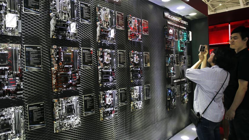 FILE - Visitors review new computer products during the Computex Taipei exhibition at the world trade center in Taipei, Taiwan, Tuesday, May 30, 2017. GlobalWafers Co., which supplies silicon wafers to semiconductor manufacturers, said on Sunday, Feb. 6, 2022, it will invest $3.6 billion in facilities in Asia, the United States and Europe after its attempt to acquire GermanyâÄ™s Siltronic AG failed. (AP Photo/Chiang Ying-ying, File)