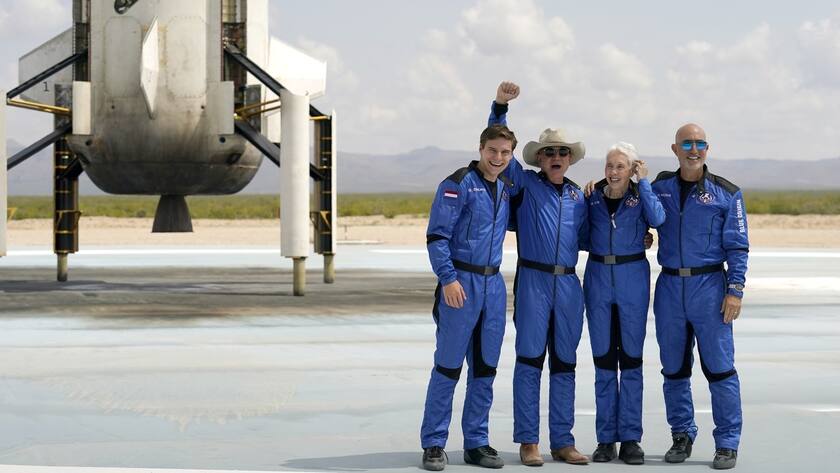 FILE - Oliver Daemen, from left, Jeff Bezos, founder of Amazon and space tourism company Blue Origin, Wally Funk and Bezos' brother Mark pose for photos in front of the Blue Origin New Shepard rocket, left rear, after their launch from the spaceport near Van Horn, Texas, Tuesday, July 20, 2021. (AP Photo/Tony Gutierrez, File)