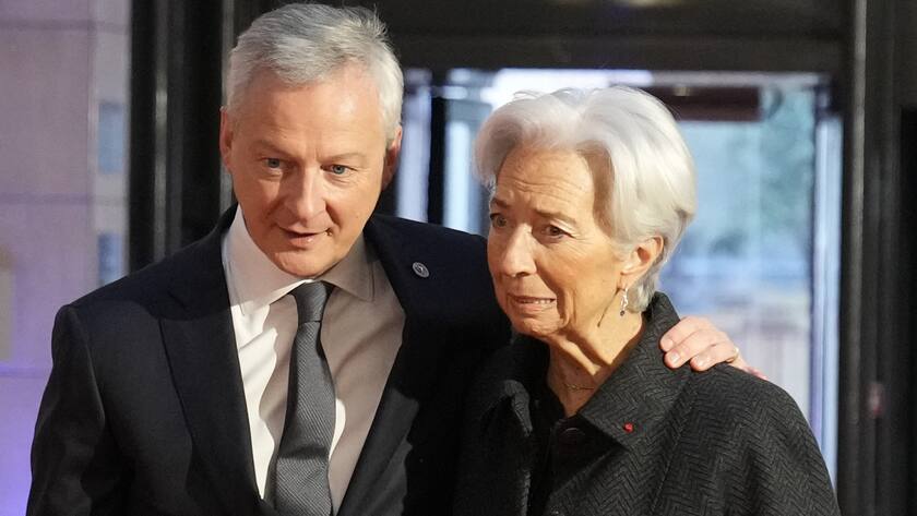 French Finance Minister Bruno Le Maire, left, welcomes the President of European Central, Bank Christine Lagarde before a European Finance Ministers meeting, Friday, Feb. 25, 2022 in Paris. The Russian invasion of Ukraine caused a barrage of new financial sanctions Thursday. The sanctions are meant to isolate, punish and impoverish Russia in the long term. (AP Photo/Francois Mori)