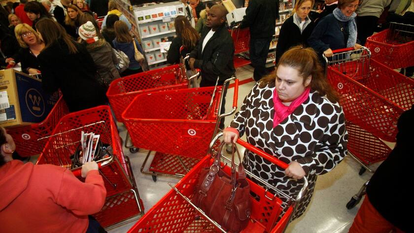 Holiday shoppers pack the electronics department of a Target store in Smithfield, R.I., Friday, Nov. 28, 2008. Retailers extended their hours _ some opening at midnight _ and offered deals that promised to be even deeper and wider than even the deep discounts that shoppers found throughout November. (AP Photo/Stew Milne)