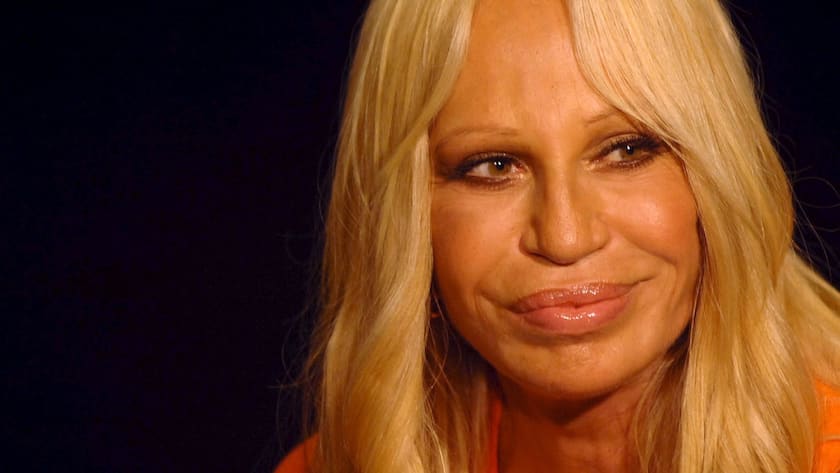 Italian fashion designer Donatella Versace poses for photographers backstage during the spring and summer male fashion presentation in Milan on Monday, 26 June 2006. EPA/MATTEO BAZZI