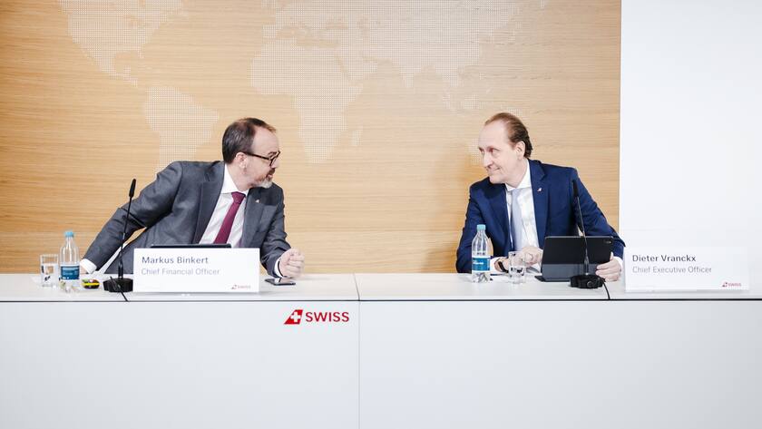Swiss International Air Lines CEO Dieter Vranckx, right, speaks to CFO Markus Binkert during a press conference announcing the airlines's 2021 full year results in Zurich Kloten, Switzerland, on Thursday. March 3, 2022. (KEYSTONE/Michael Buholzer)