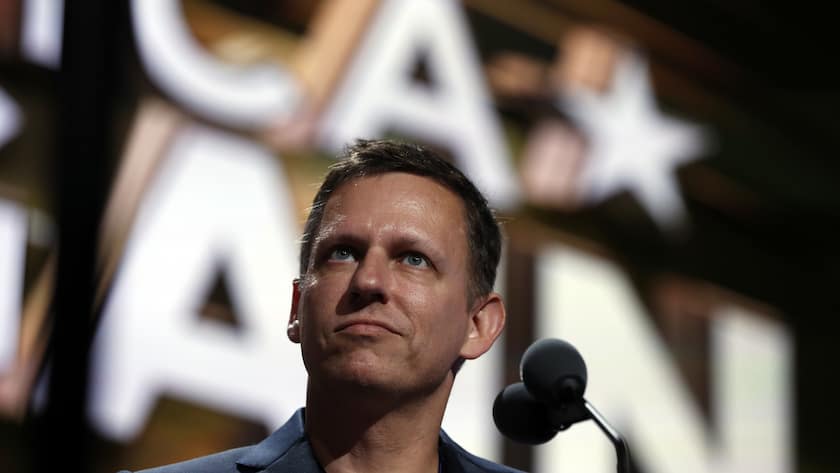 Billionaire tech investor Peter Thiel look overr the podium before the start of the second day session of the Republican National Convention in Cleveland, Tuesday, July 19, 2016. (AP Photo/Carolyn Kaster)