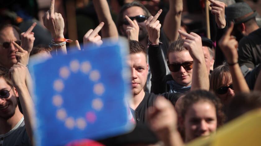 epa04667860 Protesters gather during demonstrations near the new headquarters of the European Central Bank (ECB) in Frankfurt, Germany, 18 March 2015. The new headquarters of the ECB officially opened on 18 March, while a demonstration by leftist protest group Blockupy was also set to take place. EPA/FREDIK VON ERICHSEN