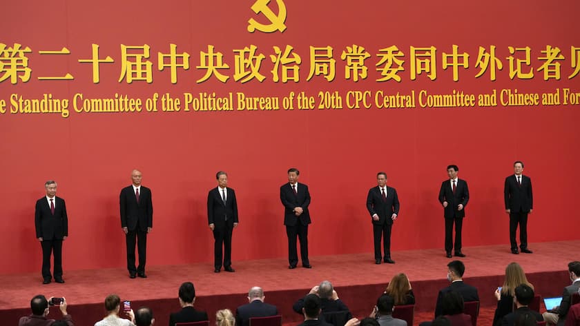 New members of the Politburo Standing Committee, from left, Li Xi, Cai Qi, Zhao Leji, President Xi Jinping, Li Qiang, Wang Huning, and Ding Xuexiang are introduced at the Great Hall of the People in Beijing, Sunday, Oct. 23, 2022. (AP Photo/Ng Han Guan)