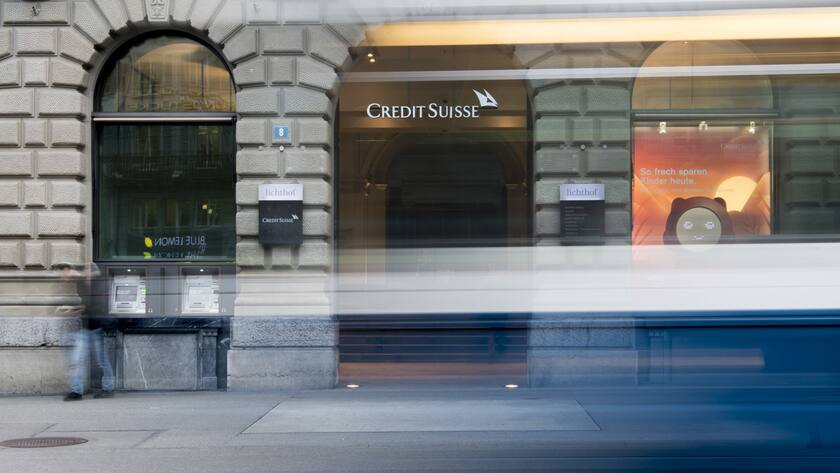 The logo of the Swiss bank Credit Suisse is pictured behind a tram in Zurich, Switzerland, Wednesday, Feburary 14, 2018. (KEYSTONE/Ennio Leanza)