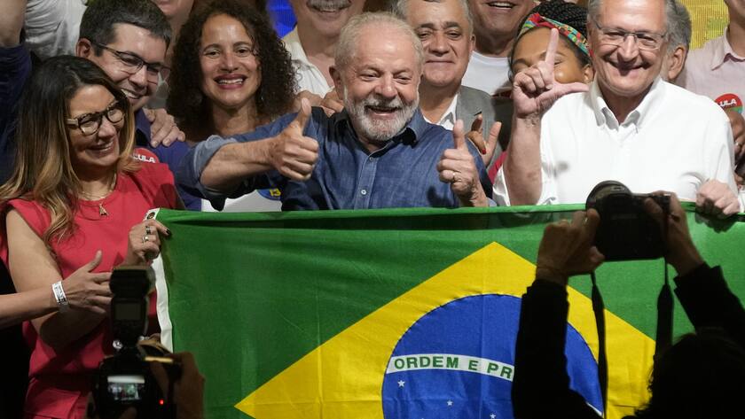 Former Brazilian President Luiz Inacio Lula da Silva celebrates with his wife Rosangela Silva, left, and running mate Geraldo Alckmin, right, after the electoral authority said that he defeated incumbent Jair Bolsonaro to become the country's next president, in Sao Paulo, Brazil, Sunday, Oct. 30, 2022. (AP Photo/Andre Penner)