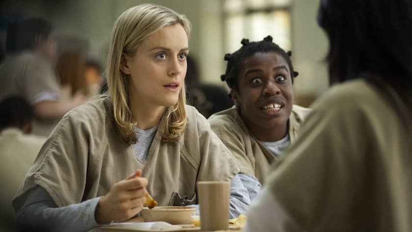 This image released by Netflix shows Taylor Schilling, left, and Uzo Aduba in a scene from "Orange is the New Black." Revealing secret endings and plot twists has brought on wrath since the dawn of cinema, straight through VCRS to streaming and DVRs. Does the 13-episode Netflix dump of "Orange is the New Black" in July equal two months of polite spoiler-free behavior? (AP Photo/Netflix, Paul Schiraldi)