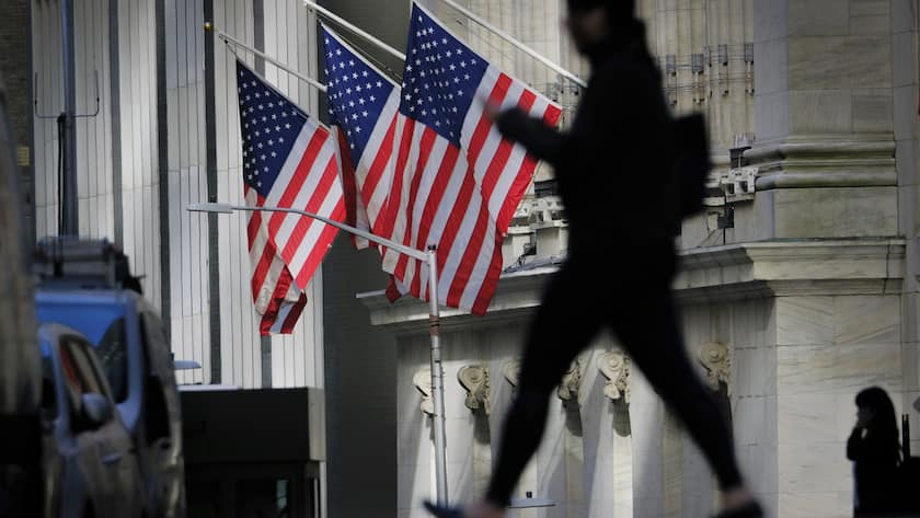 A pedestrian walks past the New York Stock Exchange in New York City, Thursday, Oct. 27, 2022. Stocks ended mixed on Wall Street as weakness in several tech companies offset gains. (AP Photo/J. David Ake)