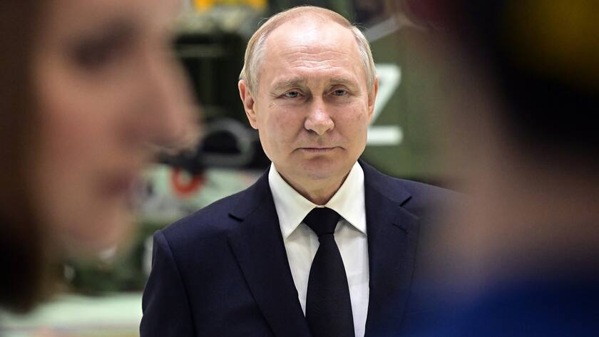 Russian President Vladimir Putin talks with employees of the Almaz-Antey Corporation's Obukhov Plant at its assembly shop in St. Petersburg, Russia, Wednesday, Jan. 18, 2023. (Ilya Pitalev, Sputnik, Kremlin Pool Photo via AP)