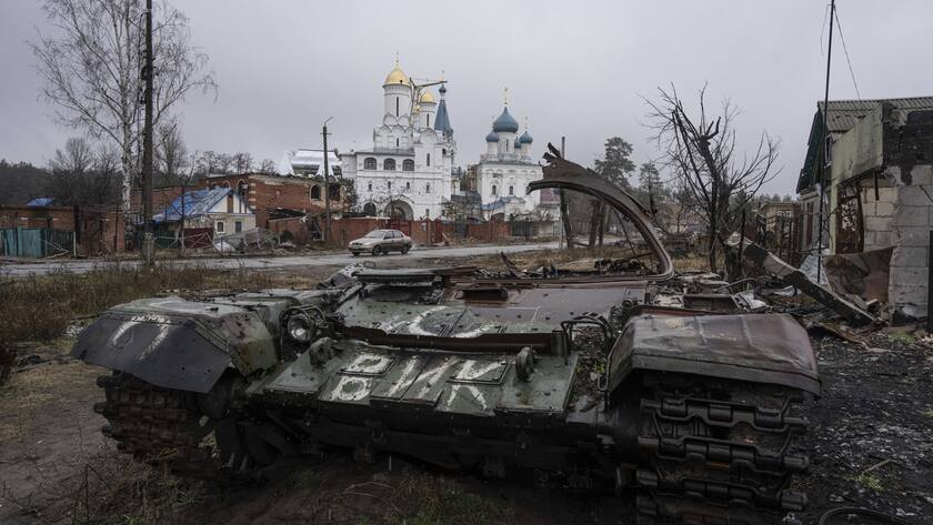 A destroyed Russian tank stands across the road of a church in the town of Sviatohirsk, Ukraine, Friday, Jan. 6, 2023.