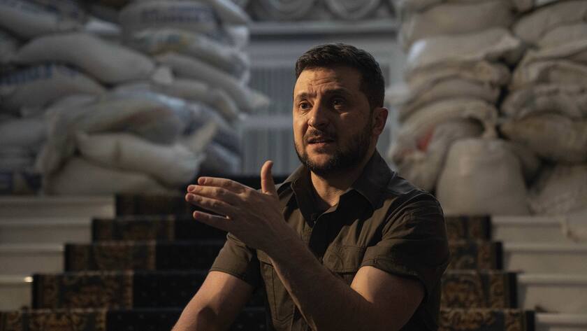 Ukrainian President Volodymyr Zelenskyy speaks during an interview with The Associated Press in his office in Kyiv, Ukraine, Saturday, April 9, 2022. Ukrainian President Volodymyr Zelenskyy says he's committed to pressing for peace despite Russian attacks on civilians that have stunned the world. (AP Photo/Evgeniy Maloletka)