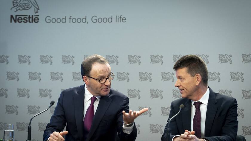 Nestle's CEO Ulf Mark Schneider, left, speaks with Nestle's CFO Francois-Xavier Roger.