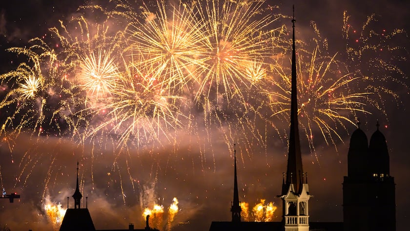 Fireworks illuminate the night sky over Zurich, Switzerland, during the New Year's Eve celebrations, on Sunday, January 1, 2023. (KEYSTONE/Michael Buholzer)
