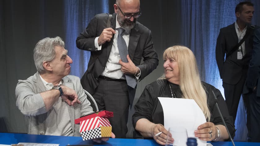 Nick Hayek, CEO, Marc Alexander Hayek, member of the management board, and Nayla Hayek, chairwoman of the board of directors, from left, talk during the ordinary general meeting of shareholders of Swatch Group at the Tissot Velodrome, in Grenchen, Switzerland, Thursday, May 23, 2019. (KEYSTONE/Peter Klaunzer)