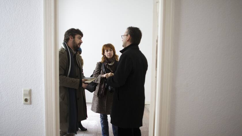Estate agent Tomas Nyisztor, right, talks to Italian couple Andrea Bricconi, left, Claudia Mosca, center, during an inspection in an empty apartment at the district Prenzlauer Berg in Berlin, Thursday, Nov. 1, 2012. Buying a home in Berlin is widely viewed as one of the safest investments a German, or any European, can make. That is why some real-estate experts are worried the market could get overheated.(AP Photo/Markus Schreiber)
