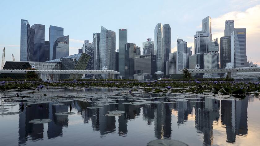 epa06899820 (FILE) - The skyline of Singapore's financial district is reflected in a lotus pond at the ArtScience Museum in Singapore, 06 June 2018 (reissued 20 July 2018). According to media reports, Hackers have gained access to health data of about 1.5 million people who had visited hospitals in Singapore between 2015 and 2018. EPA/WALLACE WOON