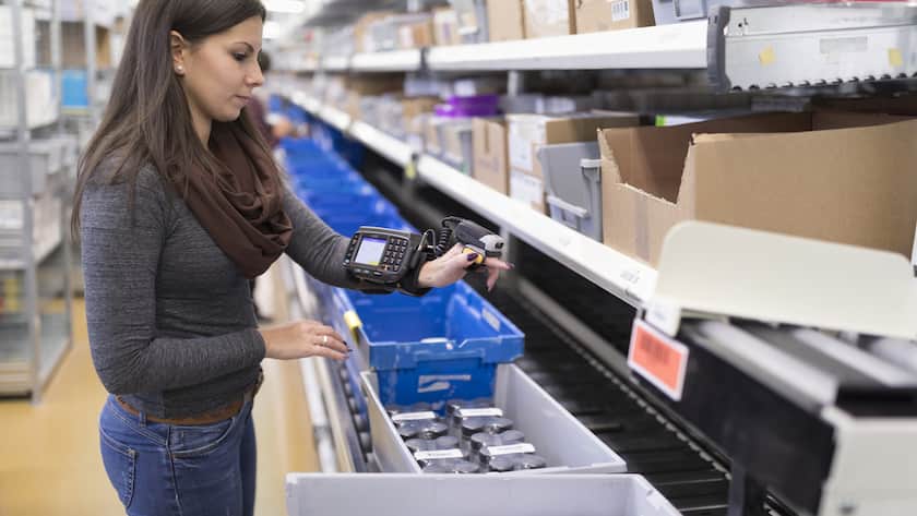 An employee uses a hand scanner to scan a barcode, pictured at the logistics center of the mail-order pharmacy Zur Rose in Frauenfeld, Canton of Thurgau, Switzerland, on November 17, 2016. The mail-order pharmacy Zur Rose sends pharmaceuticals to physicians and directly to individual customers when prescriptions are produced. (KEYSTONE/Gaetan Bally)