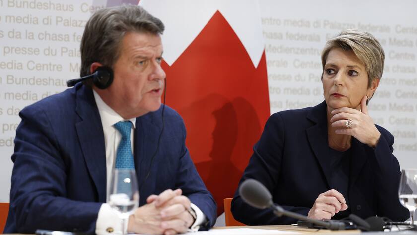 Colm Kelleher, Chairman UBS, left, speaks beside Swiss Finance Minister Karin Keller-Sutter, during a press conference, on Sunday, 19 March 2023 in Bern. Switzerland's largest bank UBS agreed to take over Credit Suisse for $3 billion Swiss francs ($3.25 billion) in a government-brokered deal over the weekend following days of market upheaval over the health of the banking sector. (KEYSTONE/Peter Klaunzer)
