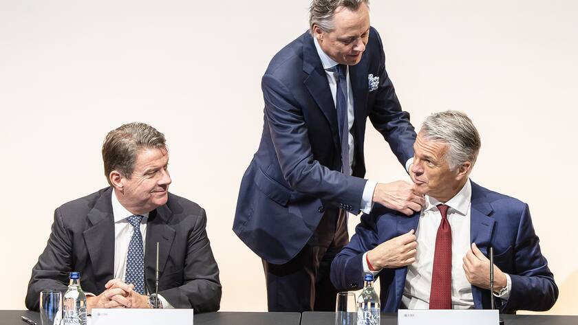 Newly appointed Group Chief Executive Officer of Swiss Bank UBS Sergio P. Ermotti, right, outgoing CEO Ralph Hamers, center, and UBS Chairman Colm Kelleher, left, arrive for news conference in Zurich, Switzerland on Wednesday, March 29, 2023. (KEYSTONE/Michael Buholzer)