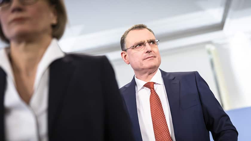 Swiss National Bank's (SNB) Chairman of the Governing Board Thomas Jordan, right, arrives with Member of the Governing Board Andrea Maechler, left, to a media briefing of the Swiss National Bank in Zurich, Switzerland, on Thursday, March 23, 2023. (KEYSTONE/Michael Buholzer).