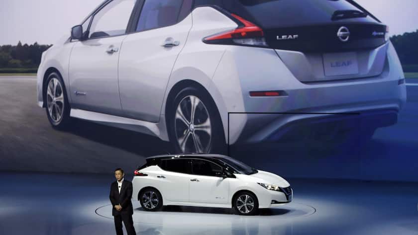 Nissan President and CEO Hiroto Saikawa unveils its new Leaf electric vehicle during the world premiere in Chiba Wednesday, Sept. 6, 2017. Nissan's new Leaf electric car goes father on a charge and comes with autonomous drive technology and single-pedal driving. But whether it can catch on with anyone but the most zealously green-minded remains to be seen. (AP Photo/Eugene Hoshiko)