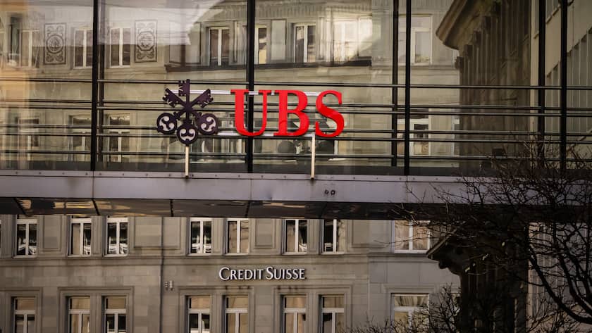 Logos of the Swiss banks Credit Suisse and UBS are displayed on buildings in Zurich, Switzerland on Saturday, March 18, 2023. (KEYSTONE/Michael Buholzer).