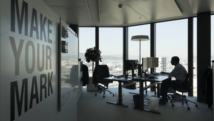 A GAM employee works at his desk in an office at the Prime Tower, a skyscraper, where the pure play asset management group GAM is headquartered, pictured in Zurich, Switzerland, on March 13, 2017. (KEYSTONE/Gaetan Bally)