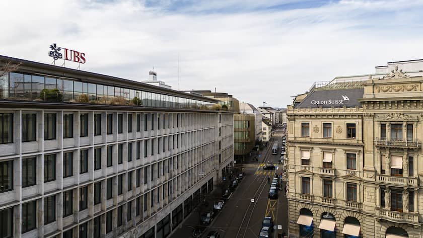 A general view shows the headquarters of the Swiss bank Credit Suisse, right, and UBS, left, at Paradeplatz in in Zurich, Switzerland on Saturday, March 18, 2023. (KEYSTONE/Michael Buholzer).
