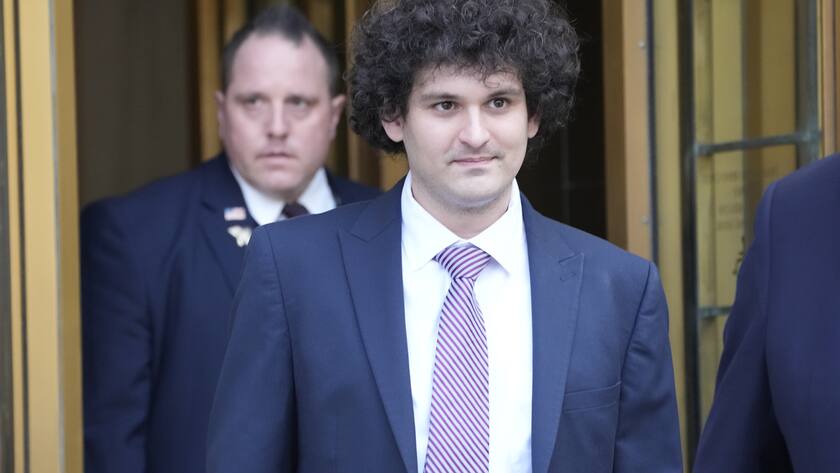 FILE - FTX founder Sam Bankman-Fried leaves Federal court, Wednesday, July 26, 2023, in New York. The Associated Press reported on stories circulating online incorrectly claiming the Department of Justice has dropped all charges against FTX founder Sam Bankman-Fried, who is accused of cheating investors and looting customer deposits on the cryptocurrency trading platform. (AP Photo/Mary Altaffer, File)