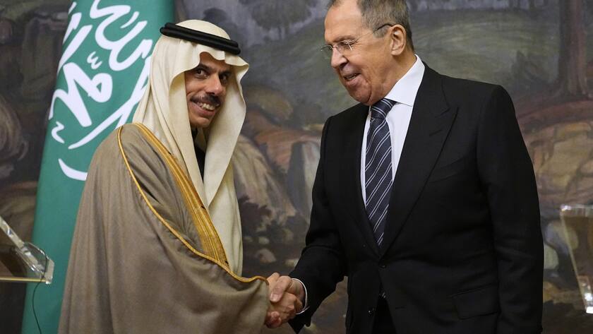 Saudi Arabia's Foreign Minister Prince Faisal bin Farhan Al-Saud (L) and Russian Foreign Minister Sergey Lavrov shake hands during a joint news conference after their talks in Moscow, Russia, 09 March 2023.