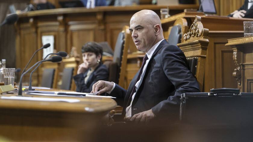 FILE - Swiss Federal President Alain Berset, front, attends an extraordinary session of the Federal Assembly in Bern, Switzerland, on April 11, 2023. On Sunday Oct. 22, 2023 Swiss voters elect the two houses of parliament, an exercise every four years that will ultimately shape the future composition of the Alpine country?s executive branch: The Federal Council. (Alessandro della Valle/Keystone via AP, File)