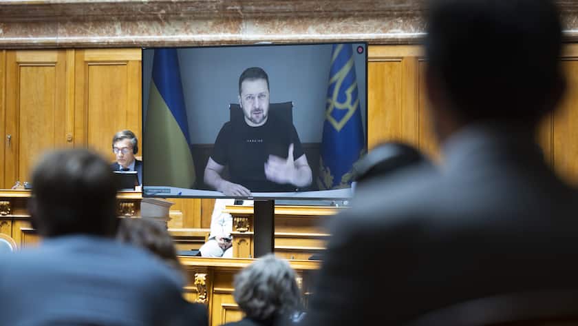 Ukrainian President Volodymyr Zelensky is displayed on a screen during his speech to the members of the Swiss parliament, in Bern, Switzerland, Thursday, June 15, 2023. (KEYSTONE/Peter Klaunzer)