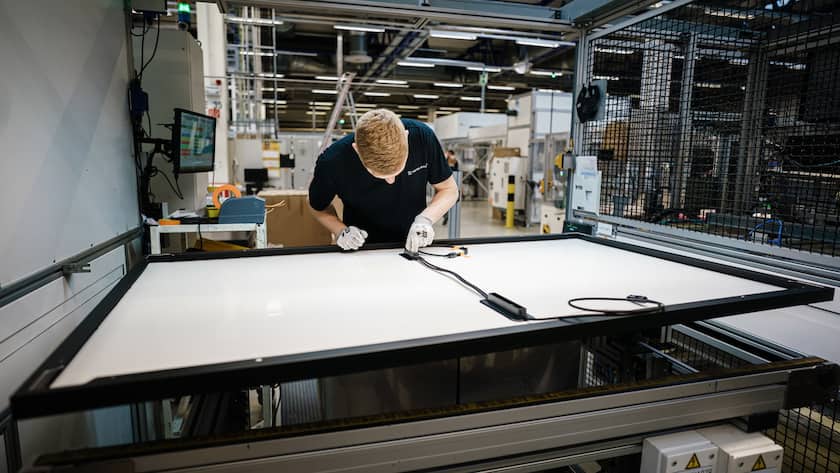 epa10353826 Employee Martin works on a solar panel at the solar module manufacturer Meyer Burger (Industries) GmbH in Freiberg, Germany, 07 December 2022. The nearly 70 year old company Meyer Burger (Industries) GmbH produces solar panels with a 40 year expertise in photovoltaics in the Saxon city of Freiberg near Dresden. EPA/CLEMENS BILAN