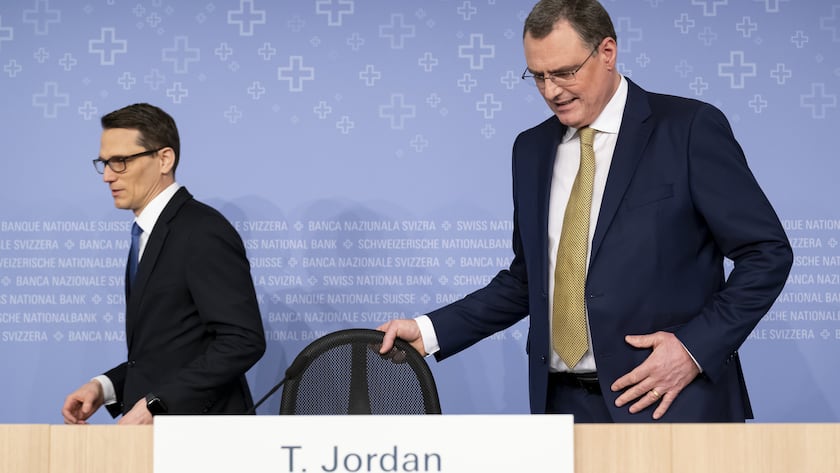 Swiss National Bank's (SNB) Chairman of the Governing Board Thomas Jordan, right, arrives with Vice Chairman of the Governing Board Martin Schlegel, left, during an end-of-year press conference of Swiss National Bank (SNB BNS), in Bern, Switzerland, Thursday, December 14, 2023. (KEYSTONE/Anthony Anex)