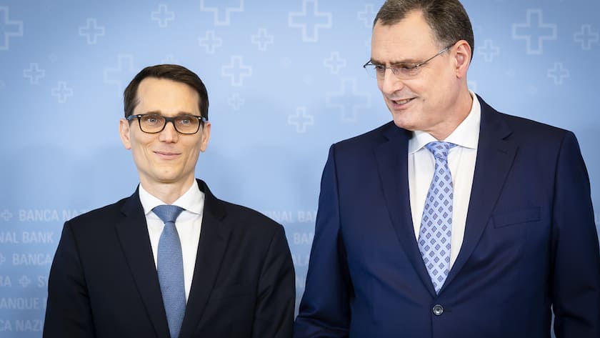 Swiss National Bank's (SNB) Chairman of the Governing Board Thomas Jordan, right, arrives with Vice Chairman of the Governing Board Martin Schlegel, left, to a media briefing at the Swiss National Bank in Zurich, Switzerland, on Thursday, March 21, 2024. (KEYSTONE/Michael Buholzer).