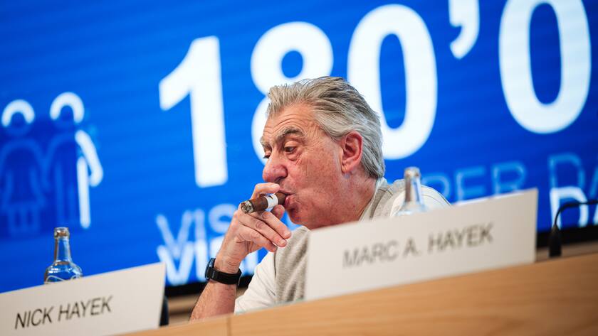 Nick Hayek, CEO Swatch Group AG, smokes a cigar, during a press conference to present the annual results for 2023, this Thursday 21 March 2024, in Biel. (KEYSTONE/Adrien Perritaz)