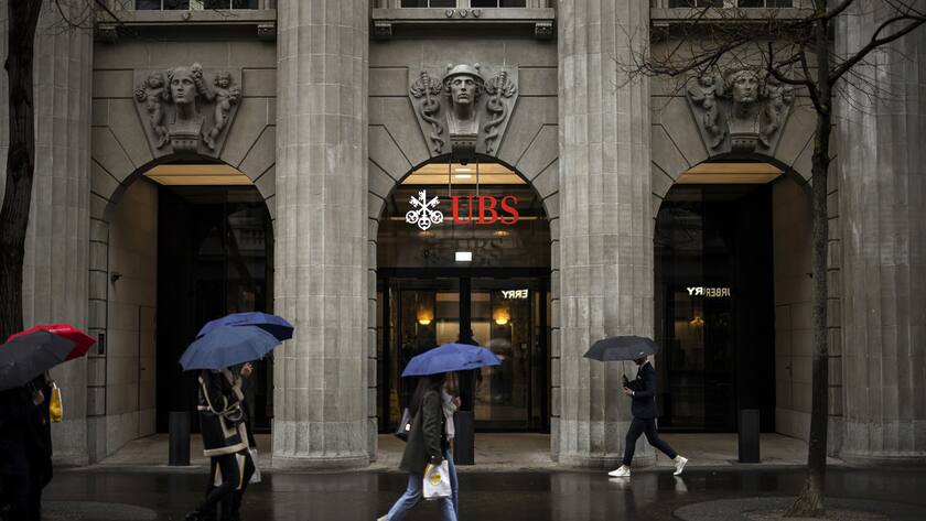 People walk past the headquarters of the Swiss bank UBS in Zurich, Switzerland, on Friday, March 24, 2023. (KEYSTONE/Michael Buholzer).