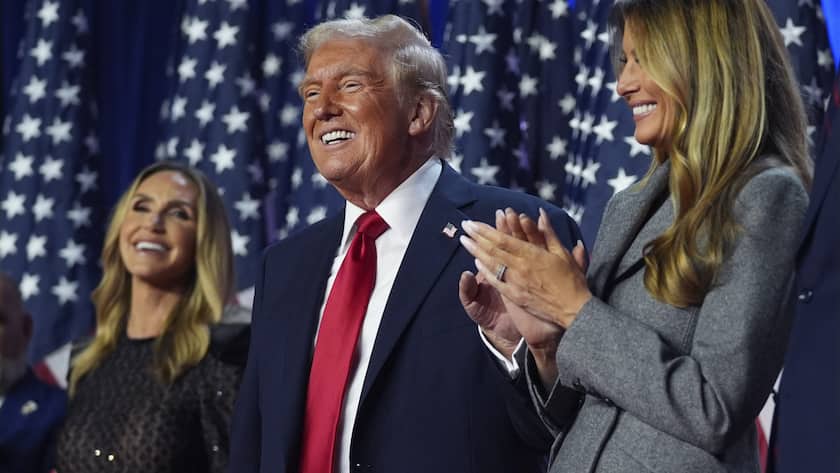 Republican presidential nominee former President Donald Trump stands on stage with former first lady Melania Trump, as Lara Trump watches, at an election night watch party at the Palm Beach Convention Center, Wednesday, Nov. 6, 2024, in West Palm Beach, Fla. (AP Photo/Evan Vucci).Donald Trump